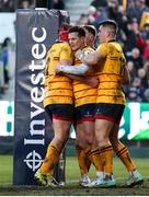 9 December 2023; Billy Burns of Ulster, centre, celebrates with team-mates after scoring his side's first try during the Investec Champions Cup Pool 2 Round 1 match between Bath and Ulster at The Recreational Ground in Bath, England. Photo by Matt Impey/Sportsfile