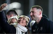 9 December 2023; Finn Russell of Bath poses for a photograph with a supporter after the Investec Champions Cup Pool 2 Round 1 match between Bath and Ulster at The Recreational Ground in Bath, England. Photo by Matt Impey/Sportsfile