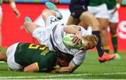 9 December 2023; Gavin Mullin of Ireland dives over Tiaan Pretorius of South Africa to score a try during the Men's Pool A match between South Africa and Ireland during the HSBC SVNS Rugby Tournament at DHL Stadium in Cape Town, South Africa. Photo by Shaun Roy/Sportsfile