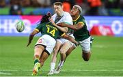 9 December 2023; Terry Kennedy of Ireland loses the ball as Rosko Specman of South Africa and Katlego Letebele of South Africa make the tackle during the Men's Pool A match between South Africa and Ireland during the HSBC SVNS Rugby Tournament at DHL Stadium in Cape Town, South Africa. Photo by Shaun Roy/Sportsfile