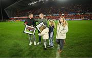 9 December 2023; Recently retired Munster players Andrew Conway, left, and Keith Earls, accompanied by his daughters Ella-May, Laurie and Emie, are introduced to the crowd at half-time during the Investec Champions Cup Pool 3 Round 1 match between Munster and Aviron Bayonnais at Thomond Park in Limerick. Photo by Brendan Moran/Sportsfile