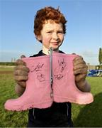 10 December 2023; As part of the club’s 12 County Tour, Leinster Rugby players Jack Conan and Ross Byrne visited Roscrea RFC for their minis’ Christmas Party. Pictured is supporter Jack Hugh with boots signed by Jack Conan and Ross Byrne at Roscrea RFC in Tipperary. Photo by Tyler Miller/Sportsfile