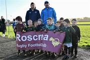10 December 2023; As part of the club’s 12 County Tour, Leinster Rugby players Jack Conan and Ross Byrne visited Roscrea RFC for their minis’ Christmas Party. Pictured are Ross Byrne and Jack Conan with the Roscrea RFC u6's team at Roscrea RFC in Tipperary. Photo by Tyler Miller/Sportsfile
