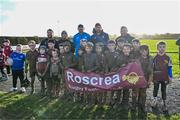 10 December 2023; As part of the club’s 12 County Tour, Leinster Rugby players Jack Conan and Ross Byrne visited Roscrea RFC for their minis’ Christmas Party. Pictured are is Jack Conan and Ross Byrne taking a photograph with the Roscrea RFC u10s team at Roscrea RFC in Tipperary. Photo by Tyler Miller/Sportsfile