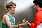 10 December 2023; Nicholas Griggs of Ireland, left, who finished third with Axel Vang Christensen of Denmark, who finished first, after the U20 men's 5000m during the SPAR European Cross Country Championships at Laeken Park in Brussels, Belgium. Photo by Sam Barnes/Sportsfile