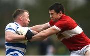 10 December 2023; Brian Hurley of Castlehaven is tackled by Conor Flannery of Dingle during the AIB Munster GAA Football Senior Club Championship Final match between Dingle, Kerry, and Castlehaven, Cork, at TUS Gaelic Grounds in Limerick. Photo by Tom Beary/Sportsfile