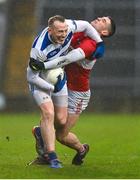 10 December 2023; Damien Cahalane of Castlehaven is tackled by Paul Geaney of Dingle during the AIB Munster GAA Football Senior Club Championship Final match between Dingle, Kerry, and Castlehaven, Cork, at TUS Gaelic Grounds in Limerick. Photo by Brendan Moran/Sportsfile