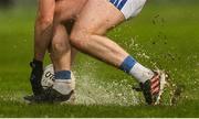 10 December 2023; A player attempts to lift the ball on the wet surface during the AIB Munster GAA Football Senior Club Championship Final match between Dingle, Kerry, and Castlehaven, Cork, at TUS Gaelic Grounds in Limerick. Photo by Brendan Moran/Sportsfile