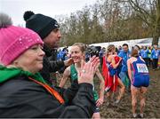 10 December 2023; Fionnuala McCormack of Ireland is congratulated by physiotherapist Declan Monaghan after finishing fourth in the senior women's 9000m during the SPAR European Cross Country Championships at Laeken Park in Brussels, Belgium. Photo by Sam Barnes/Sportsfile