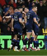 10 December 2023; Jordan Larmour of Leinster, left, celebrates with teammates after scoring their side's first try during the Investec Champions Cup match between La Rochelle and Leinster at Stade Marcel Deflandre in La Rochelle, France. Photo by Harry Murphy/Sportsfile