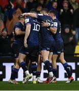 10 December 2023; Jordan Larmour of Leinster, left, celebrates with teammates after scoring their side's first try during the Investec Champions Cup match between La Rochelle and Leinster at Stade Marcel Deflandre in La Rochelle, France. Photo by Harry Murphy/Sportsfile