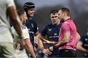 10 December 2023; Leinster co-captains James Ryan, left, and Garry Ringrose in conversation with referee Matthew Carley during the Investec Champions Cup match between La Rochelle and Leinster at Stade Marcel Deflandre in La Rochelle, France. Photo by Harry Murphy/Sportsfile