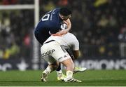 10 December 2023; Harry Byrne of Leinster is tackled by Reda Wardi of La Rochelle during the Investec Champions Cup match between La Rochelle and Leinster at Stade Marcel Deflandre in La Rochelle, France. Photo by Harry Murphy/Sportsfile