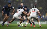 10 December 2023; Ryan Baird of Leinster is tackled by Jonathan Danty, left, and UJ Seuteni of La Rochelle during the Investec Champions Cup match between La Rochelle and Leinster at Stade Marcel Deflandre in La Rochelle, France. Photo by Harry Murphy/Sportsfile