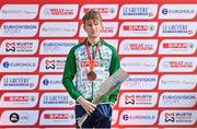 10 December 2023; Nicholas Griggs of Ireland on the podium after finishing third in the U20 men's 5000m during the SPAR European Cross Country Championships at Laeken Park in Brussels, Belgium. Photo by Sam Barnes/Sportsfile