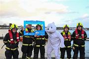 10 December 2023; Pictured at the Dungarvan Polar Plunge is members of Dungarvan fire brigade which saw participants get “Freezin’ for a Reason” to raise funds for Special Olympics Ireland athletes in an event sponsored by Gala Retail at Dungarvan Beach in Waterford. Photo by Eóin Noonan/Sportsfile