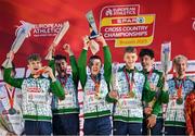 10 December 2023; Ireland athletes from left, Nicholas Griggs, Jonas Stafford, Harry Colbert, Seamus Robinson, Niall Murphy and Shane Brosnan celebrate on the podium after Ireland won team gold in the U20 men's 5000m during the SPAR European Cross Country Championships at Laeken Park in Brussels, Belgium. Photo by Sam Barnes/Sportsfile