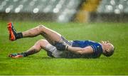 10 December 2023; Damien Cahalane of Castlehaven, who stood in goal for the penalty shoot out, reacts with cramps moments after the final whistle of the AIB Munster GAA Football Senior Club Championship Final match between Dingle, Kerry, and Castlehaven, Cork, at TUS Gaelic Grounds in Limerick. Photo by Brendan Moran/Sportsfile