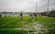 10 December 2023; Jack Cahalane of Castlehaven in action against Dylan Geaney of Dingle on a very wet pitch during the AIB Munster GAA Football Senior Club Championship Final match between Dingle, Kerry, and Castlehaven, Cork, at TUS Gaelic Grounds in Limerick. Photo by Brendan Moran/Sportsfile