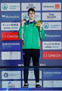 10 December 2023; Daniel Wiffen of Ireland receives his gold medal after winning the Men's 800m Freestyle, setting a new world record of 7:20.46, during day six of the European Short Course Swimming Championships 2023 at the Aquatics Complex in Otopeni, Romania. Photo by Nikola Krstic/Sportsfile