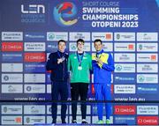 10 December 2023; Daniel Wiffen of Ireland receives his gold medal after winning the Men's 800m Freestyle, alongside silver medallist David Aubry of France, left, and bronze medallist Mykhailo Romanchuk of Ukraine, right, during day six of the European Short Course Swimming Championships 2023 at the Aquatics Complex in Otopeni, Romania. Photo by Nikola Krstic/Sportsfile