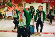 11 December 2023; Ireland’s European Cross Country Team returning to Dublin Airport this morning following another hugely successful competition in Brussels yesterday. The returning team including U20 men's 5000m team Gold medallist and individual bronze medallist Nicholas Griggs. Photo by Ben McShane/Sportsfile
