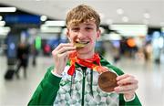 11 December 2023; Ireland’s European Cross Country Team returning to Dublin Airport this morning following another hugely successful competition in Brussels yesterday. The returning team including U20 men's 5000m team Gold medallist and individual bronze medallist Nicholas Griggs. Photo by Ben McShane/Sportsfile