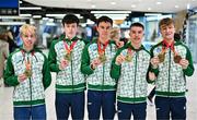 11 December 2023; Ireland’s European Cross Country Team returning to Dublin Airport this morning following another hugely successful competition in Brussels yesterday. The returning team including U20 men's 5000m team gold medallists, from left, Shane Brosnan, Niall Murphy, Jonas Stafford, Harry Colbert and individual bronze medallist Nicholas Griggs, not present is Ireland teammate Seamus Robinson. Photo by Ben McShane/Sportsfile