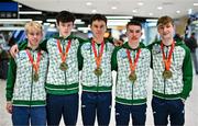 11 December 2023; Ireland’s European Cross Country Team returning to Dublin Airport this morning following another hugely successful competition in Brussels yesterday. The returning team including U20 men's 5000m team gold medallists, from left, Shane Brosnan, Niall Murphy, Jonas Stafford, Harry Colbert and individual bronze medallist Nicholas Griggs, not present is Ireland teammate Seamus Robinson. Photo by Ben McShane/Sportsfile