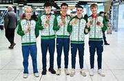 11 December 2023; Ireland’s European Cross Country Team returning to Dublin Airport this morning following another hugely successful competition in Brussels yesterday. The returning team including U20 men's 5000m team gold medallists, from left, Shane Brosnan, Niall Murphy, Jonas Stafford, Harry Colbert and individual bronze medallist Nicholas Griggs, not present is Ireland teammate Seamus Robinson. Photo by Ben McShane/Sportsfile