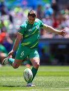 9 December 2023; Billy Dardis of Ireland kicks the ball during the Men's Pool A match between Ireland and Great Britain during the HSBC SVNS Rugby Tournament at DHL Stadium in Cape Town, South Africa. Photo by Shaun Roy/Sportsfile