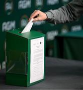 9 December 2023; A delegate casts their vote during an extraordinary general meeting in advance of the Football Association of Ireland's annual general meeting at the Radisson Blu St. Helen's Hotel in Dublin. Photo by Stephen McCarthy/Sportsfile