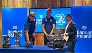 11 December 2023; Leinster players Ross Molony and Sam Prendergast draw names alongside Senior communications & media manager Marcus Ó Buachalla during the Bank of Ireland Leinster School's Cup Draw at Bank of Ireland Montrose Branch in Dublin. Photo by Harry Murphy/Sportsfile
