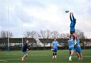 12 December 2023; Joe McCarthy is lifted in a lineout by Andrew Porter and Thomas Clarkson during a Leinster Rugby squad training session at UCD in Dublin. Photo by Harry Murphy/Sportsfile