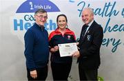 14 December 2023; St Patrick's Drumahair, Leitrim, representative Tracey Kelly is presented their Gold Healthy Club award by Connacht GAA secretary John Prenty, left, and Connacht GAA Council president John Murphy, right, during the Irish Life Connacht GAA Healthy Clubs recognition event at the Connacht GAA Centre of Excellence in Bekan, Mayo. Photo by Ben McShane/Sportsfile