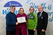 14 December 2023; Breaffy, Mayo, representative Toni Bourke and Helen Heneghan is presented their Silver Healthy Club award by Connacht GAA secretary John Prenty, left, and Connacht GAA Council president John Murphy, right, during the Irish Life Connacht GAA Healthy Clubs recognition event at the Connacht GAA Centre of Excellence in Bekan, Mayo. Photo by Ben McShane/Sportsfile