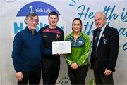 14 December 2023; Ballinrobe, Mayo, representatives Evan Reaney and Martina McCormack is presented their Foundation Healthy Club award by Connacht GAA secretary John Prenty, left, and Connacht GAA Council president John Murphy, right, during the Irish Life Connacht GAA Healthy Clubs recognition event at the Connacht GAA Centre of Excellence in Bekan, Mayo. Photo by Ben McShane/Sportsfile