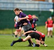 14 December 2023; Colm Wheelan Smith of Creagh College is tackled by Sean Touhy, left, and Daniel Downey of St. Mary’s CBC during the Division 3A JCT Development Shield final match between St. Mary’s CBC, Portlaoise and Creagh College at Energia Park in Dublin. Photo by Stephen Marken/Sportsfile