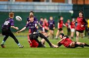 14 December 2023; Colm Wheelan Smith of Creagh College gets his pass away despite the efforts of Sean Touhy, left, and Daniel Downey of St. Mary’s CBC during the Division 3A JCT Development Shield final match between St. Mary’s CBC, Portlaoise and Creagh College at Energia Park in Dublin. Photo by Stephen Marken/Sportsfile