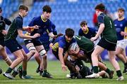 14 December 2023; Kevin Anantharajah of St Kevin’s Dunlavin is tackled by Harry Smith, left, and Stephen Duke of East Glendalough School during the Pat Rossiter Cup final match between East Glendalough School and St. Kevin’s Dunlavin at Energia Park in Dublin. Photo by Ben McShane/Sportsfile