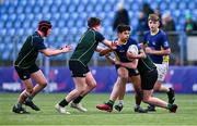 14 December 2023; Kevin Anantharajah of St Kevin’s Dunlavin is tackled by Jack Collins, left, and Ethan Whitney of East Glendalough School during the Pat Rossiter Cup final match between East Glendalough School and St. Kevin’s Dunlavin at Energia Park in Dublin. Photo by Ben McShane/Sportsfile