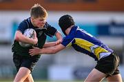 14 December 2023; William Cherry of East Glendalough School is tackled by Stephen Anderson of St Kevin’s Dunlavin during the Pat Rossiter Cup final match between East Glendalough School and St. Kevin’s Dunlavin at Energia Park in Dublin. Photo by Ben McShane/Sportsfile