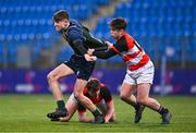 14 December 2023; James Curry of East Glendalough School is tackled by Daniel Thornton of St Mary's CBS, Portlaoise, during the Anne McInerney Cup final match between St Mary's CBS, Portlaoise and East Glendalough School at Energia Park in Dublin. Photo by Ben McShane/Sportsfile