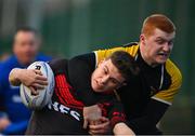 14 December 2023; Daniel Cox of Kildare Town CS is tackled by Aaron Donnelly of Patricians Secondary School, Newbridge during the Division 3A SCT Development Shield final match between Patricians Secondary School, Newbridge and Kildare Town CS at Energia Park in Dublin. Photo by Stephen Marken/Sportsfile
