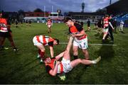 14 December 2023; Ciaran O'Brien-McCormack, right, and Jake Byrne, left, assist St. Mary's CBS, Portlaoise, teammate Evan Bergin after he had a leg cramp in the celebrations after the Anne McInerney Cup final match between St Mary's CBS, Portlaoise and East Glendalough School at Energia Park in Dublin. Photo by Ben McShane/Sportsfile