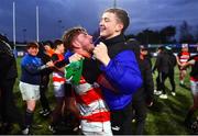 14 December 2023; Evan Bergin of St Mary's CBS, Portlaoise, celebrates with a supporter after the Anne McInerney Cup final match between St Mary's CBS, Portlaoise and East Glendalough School at Energia Park in Dublin. Photo by Ben McShane/Sportsfile