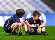 24 October 2023; Rhys Ó Mongaigh Cuidithe, right, is consoled by Gaelscoil Míde teammate Conall Ó Gallachóir after the match between St Joseph's NS Clondalkin and Gaelscoil Míde at the Allianz Cumann na mBunscol Finals at Croke Park in Dublin. Photo by Ben McShane/Sportsfile