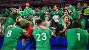 14 October 2023; Ireland players, from left, Caelan Doris, Jimmy O'Brien and Andrew Porter are consoled by family members after their side's defeat in the 2023 Rugby World Cup quarter-final match between Ireland and New Zealand at the Stade de France in Paris, France. Photo by Brendan Moran/Sportsfile