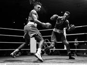 11 November 2023; (EDITORS NOTE: Image has been converted to black and white) Gabriel Dossen of Olympic Boxing Club, Galway, left, and Kelyn Cassidy of Saviours Crystal Boxing Club, Waterford, during their light heavyweight 80kg final bout at the IABA National Elite Boxing Championships 2024 Finals at the National Boxing Stadium in Dublin. Photo by Seb Daly/Sportsfile