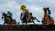 3 August 2023; Sir Argus, centre, with Brian Hayes up, jumps the first during the Guinness Beginners Steeplechase, alongside eventual winner Mars Harper, right, with Sam Ewing up, during day four of the Galway Races Summer Festival at Ballybrit Racecourse in Galway. Photo by Seb Daly/Sportsfile